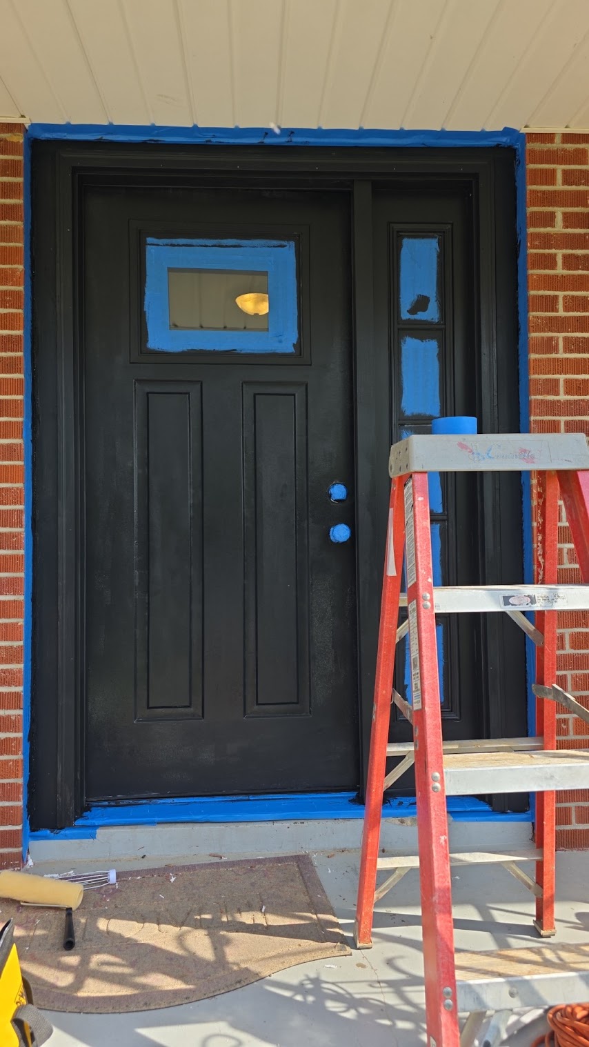 Black double entry door installation