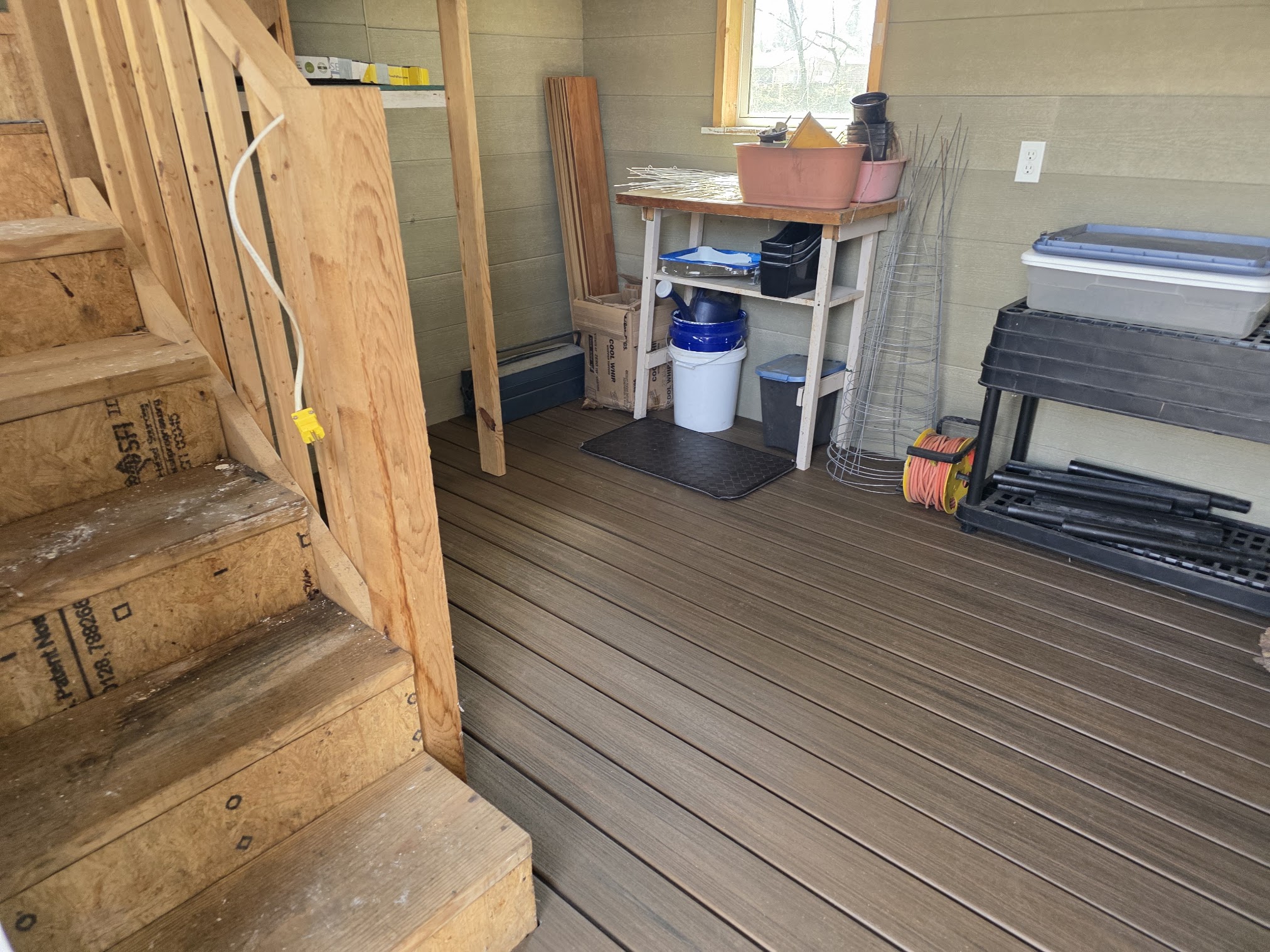 Composite decking installed as a floor inside a shed