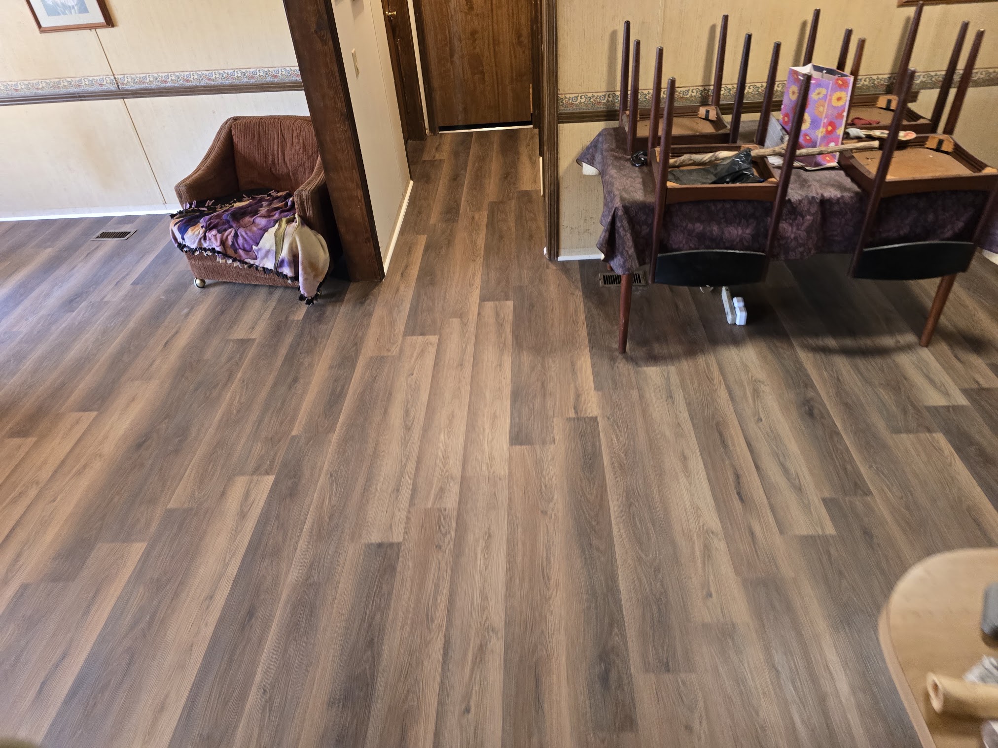 Handy Hands laminate flooring across a living and dining area