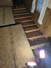 Damaged subfloor exposed during flooring repair