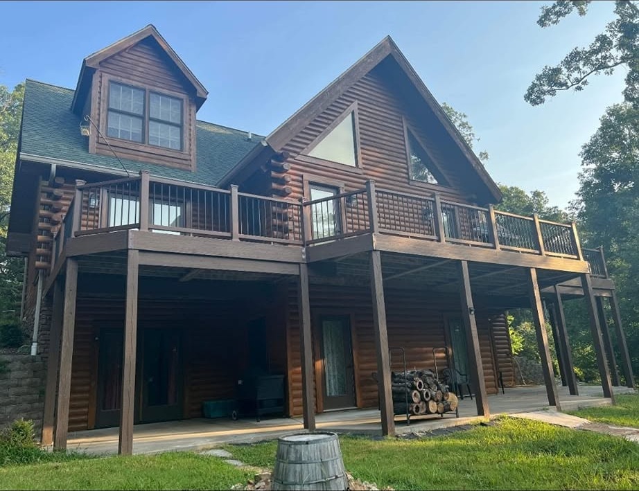Custom log home deck side view
