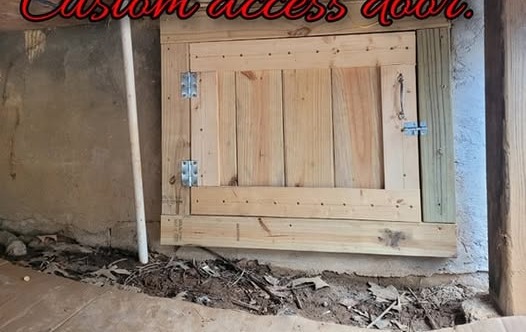 Custom access door built under a house