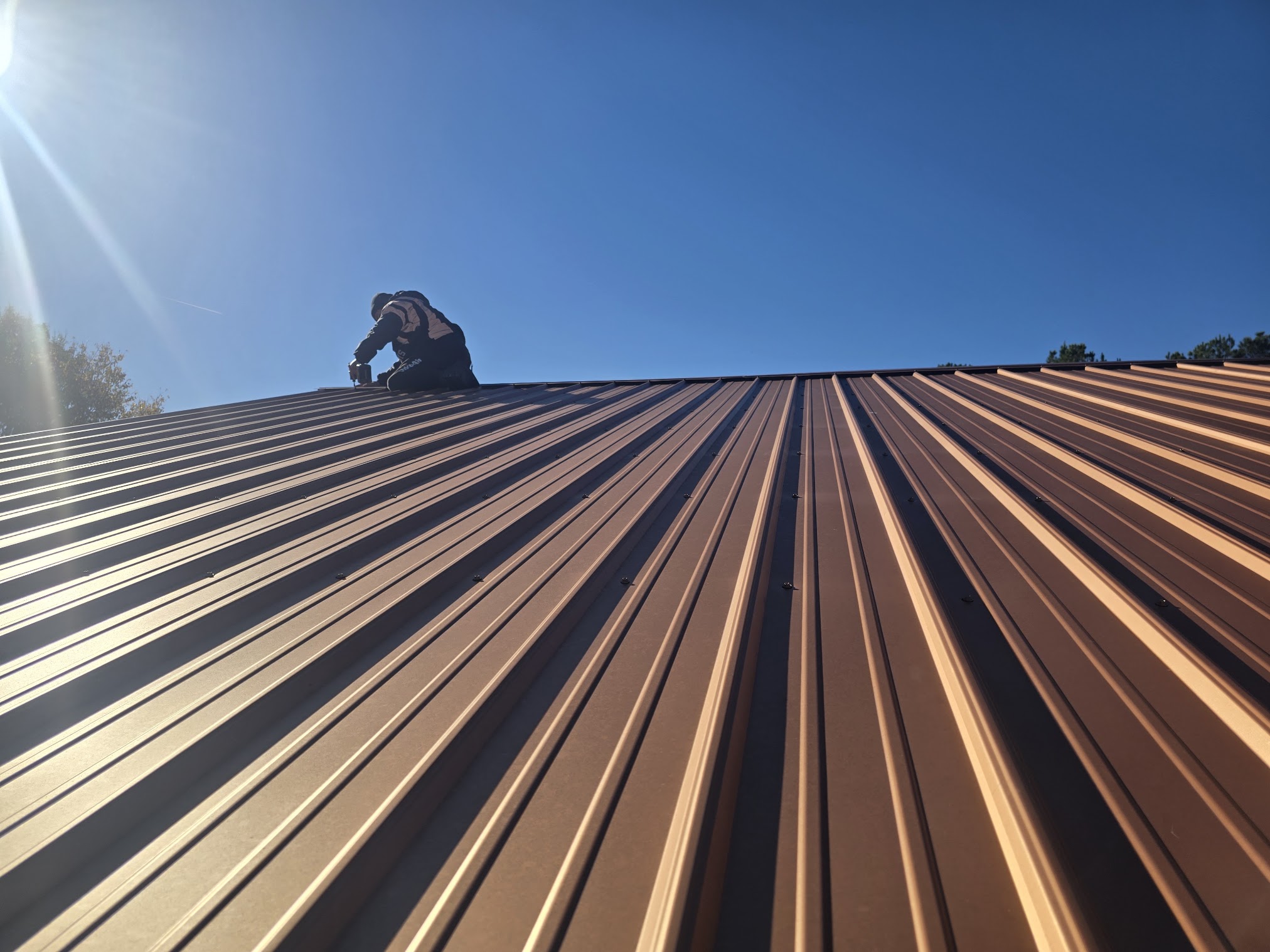Finished metal roof installed by Handy Hands